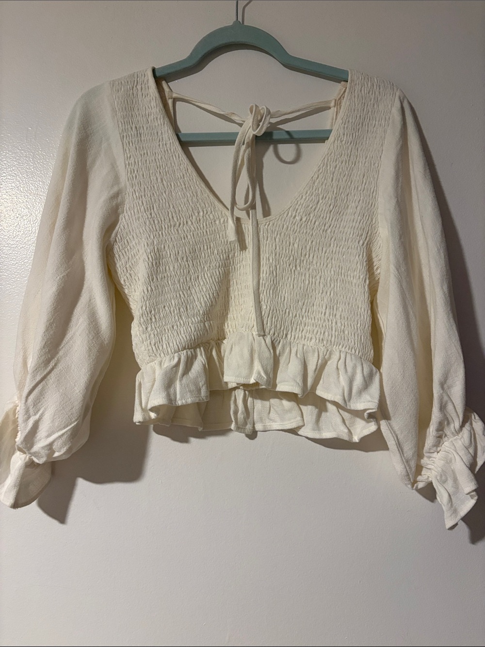 Cream Smocked Tie-Back Ruffle Peplum Blouse